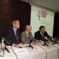 members of Japan400 press launch panel seated behind a table and in front of logo